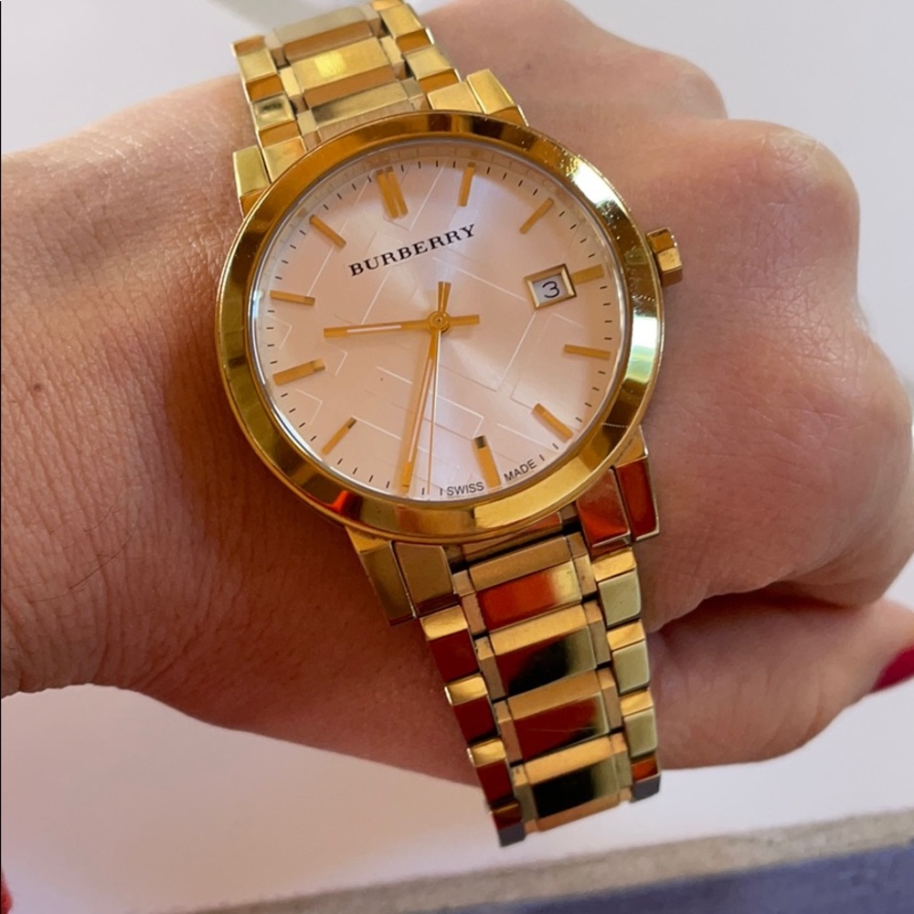 Gold Burberry watch. Moderate wear.